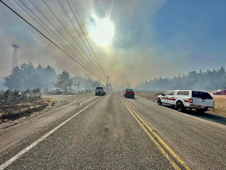 This photo from Washington State Patrol Trooper Katherine Weatherwax shows smoke coming from a large brush fire near Shelton on Tuesday.