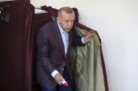 Turkey's President Recep Tayyip Erdogan casts his ballot at a polling station in Istanbul, Sunday, June 23, 2019. Polls have opened in a repeat election in Turkey's largest city where Erdogan and his political allies could lose control of Istanbul's administration for the first time in 25 years. (AP Photo/Emrah Gurel)