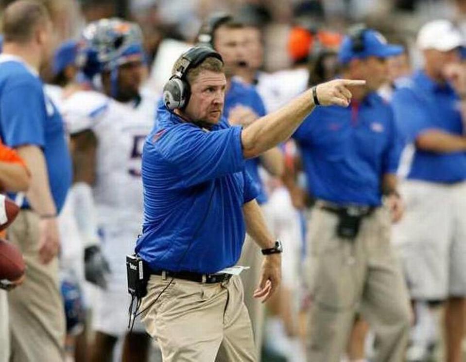 Boise State assistant coach Jeff Choate signals the Bronco defense against Hawaii on Oct. 24, 2009, in Honolulu.