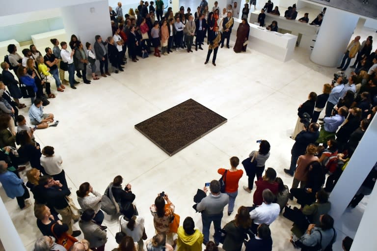 Visitors look at an artistic performance at the National museum of Contemporary Art in Athens, on April 7, 2017, on the eve of the public opening of the 14th edition of the Documenta 14 art exhibition