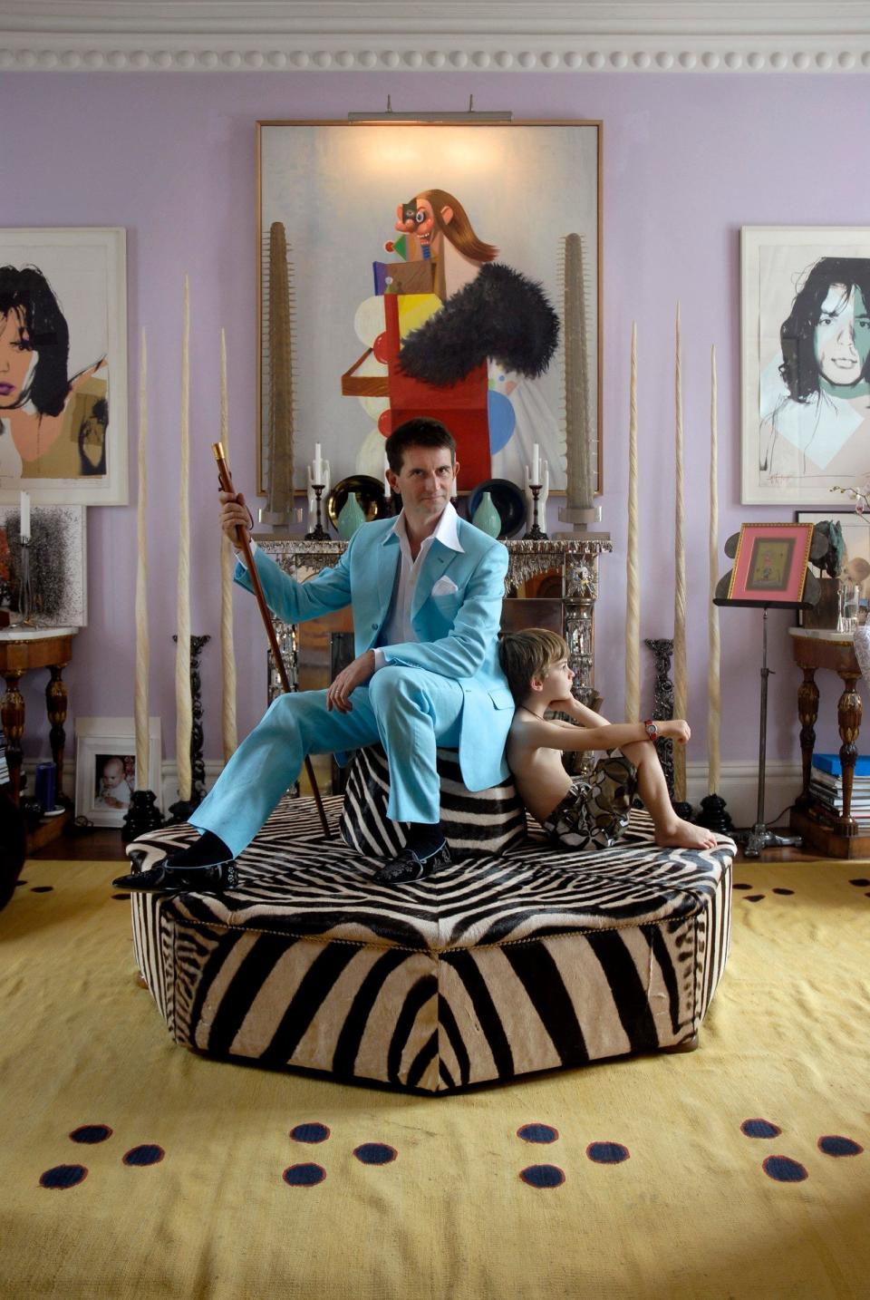 count manfredi and his son aliotto in a purple maximalist living room