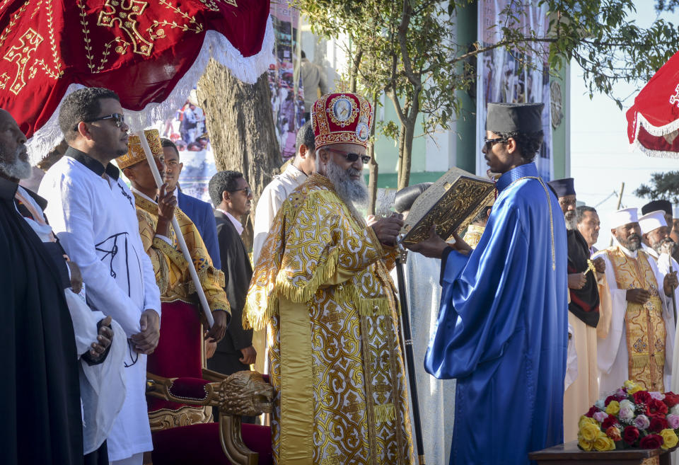 Patriarch of the Ethiopian Orthodox Church, Abune Mathias, reads the benediction during the annual festival of Timkat, or Epiphany, marking the baptism of Jesus Christ in the River Jordan, in the capital Addis Ababa, Ethiopia Monday, Jan. 20, 2020. During Timkat celebrations elsewhere in the country, in the city of Gondar, at least three people are dead after a wooden stand erected for the event collapsed on Monday, according to a hospital source. (AP Photo)