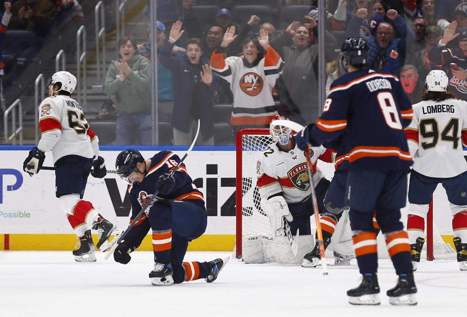 New York Islanders center Aatu Raty (16) celebrates after his goal in his first NHL hockey game during the third period against the Florida Panthers, Friday, Dec. 23, 2022, in Elmont, New York. (AP Photo/John Munson)