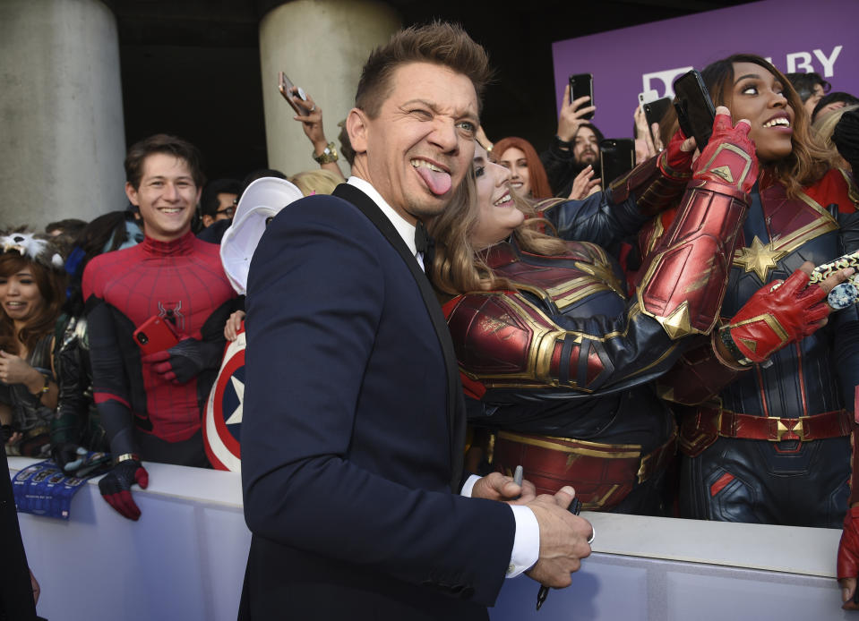 Jeremy Renner takes a selfie with a fan as he arrives at the premiere of "Avengers: Endgame" at the Los Angeles Convention Center on Monday, April 22, 2019. (Photo by Chris Pizzello/Invision/AP)