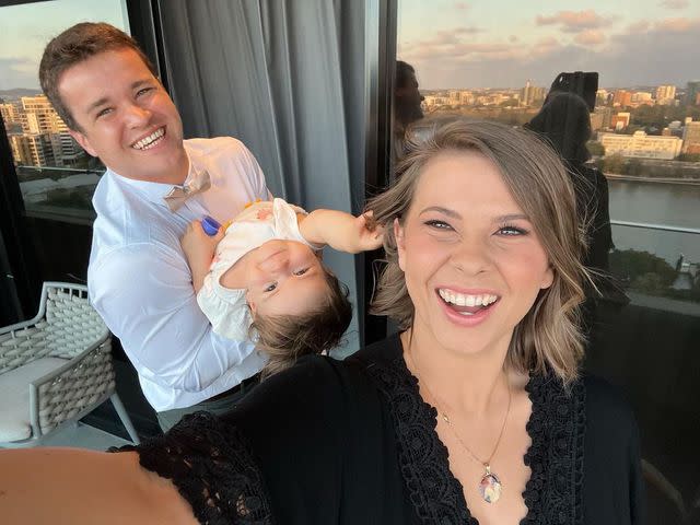 <p>Chandler Powell/Instagram</p> Chandler Powell, Bindi Irwin and their daughter Grace via Instagram