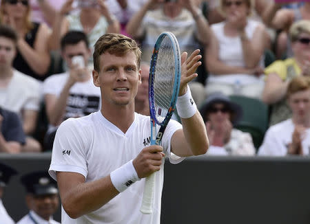 Tomas Berdych of the Czech Republic celebrates after winning his match against Nicolas Mahut of France at the Wimbledon Tennis Championships in London, July 2, 2015. REUTERS/Toby Melville