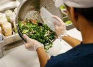 A worker prepares an order in the kitchen at the newest Chopt Creative Salad Co., location in New York