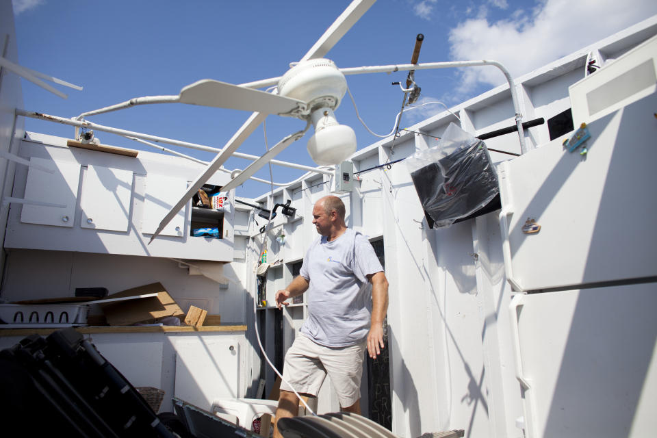 NEW YORK, NY - SEPTEMBER 8: Danny Fallon of Brooklyn, New York inspects the damage in his rental cabana where a tornado touched down on September 8, 2012 in the Breezy Point neighborhood of the Queens borough of New York City. The National Weather Service has issued a tornado watch as severe weather continues to move through New York metro area. (Photo by Ramin Talaie/Getty Images)