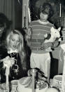 <p>Mick Jagger held a balloon and stuffed animal, while Jerry Hall prepared to share the cake at her baby shower.</p>