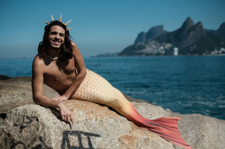 Davi de Oliveira Moreira, known as Sereio (merman in Portuguese), poses in his mermaid tail costume at Arpoador Rock on Ipanema Beach in Rio de Janeiro, Brazil, on May 3, 2017