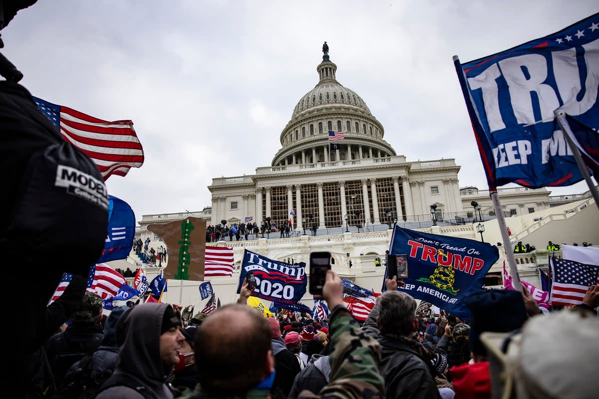 Pro-Trump supporters storm the US Capitol following a rally with President Donald Trump on January 6, 2021 in Washington, DC (Getty)