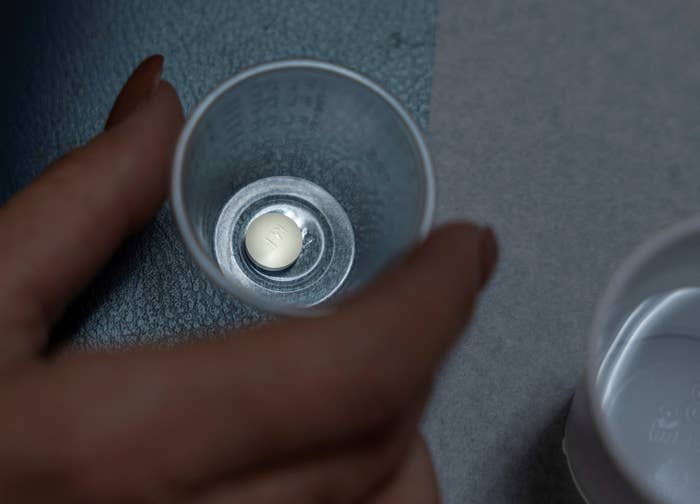 A patient prepares to take mifepristone, the first pill given in a medical abortion, at Women's Reproductive Clinic of New Mexico in Santa Teresa, US.