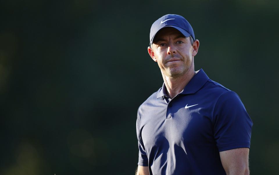 Rory McIlroy looks on as he walks off the 18th hole