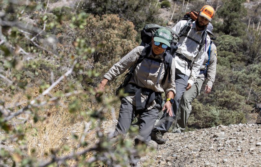 Angeles National Forest, CA - September 15 2022- U.S. Geological Survey biologist Liz Gallegos leads her team as they hike into a remote canyon to release Southern California Mountain yellow-legged frogs into a creek in the San Gabriel Mountains Thursday, Sept. 15, 2022 in Angeles National Forest, CA. (Brian van der Brug / Los Angeles Times)