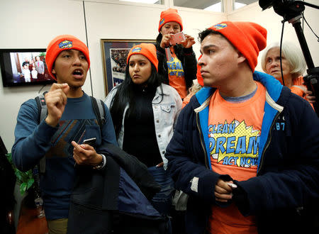 Protesters calling for an immigration bill addressing the so-called Dreamers, young adults who were brought to the United States as children, crowd in to the office of Senator Chuck Grassley on Capitol Hill in Washington, U.S., January 16, 2018. REUTERS/Joshua Roberts