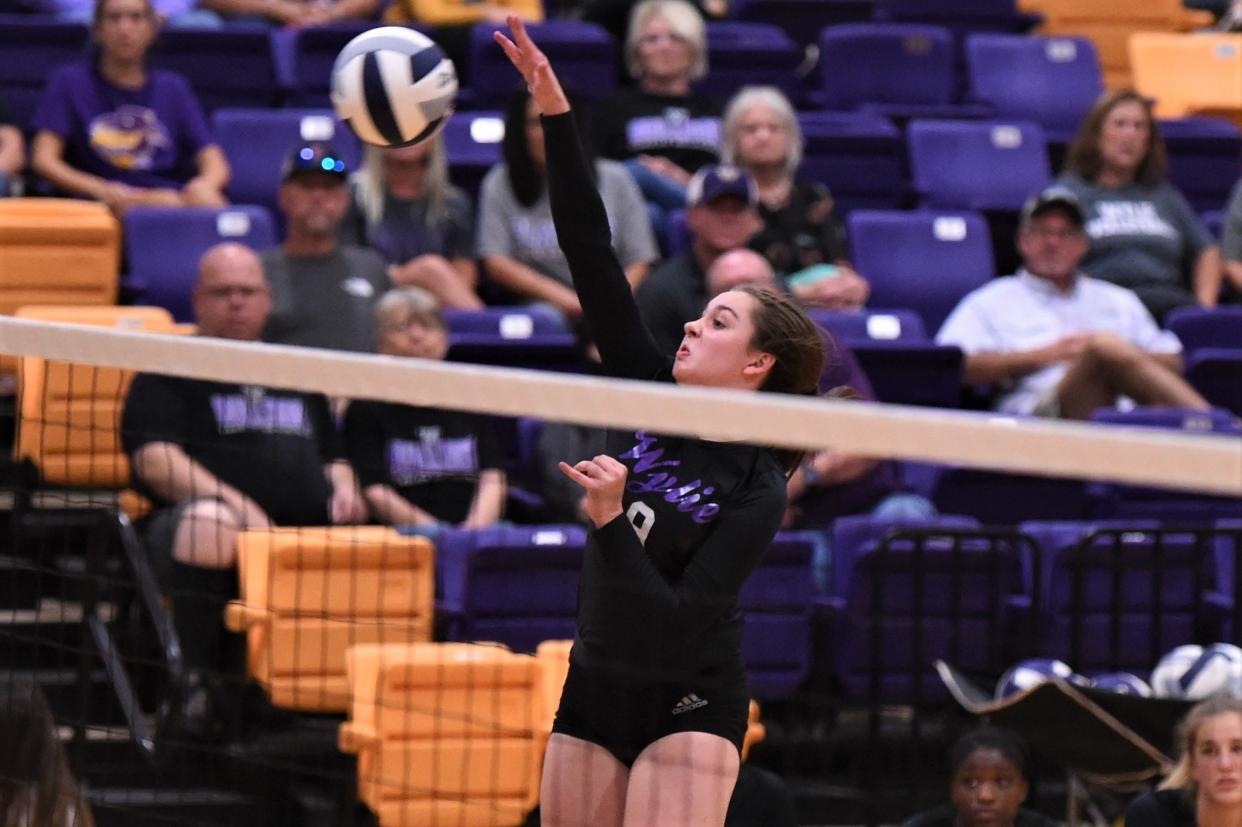 Wylie's Aliyah Jowers (9) spikes the ball against Midland Christian on Aug. 31 at Bulldog Gym.