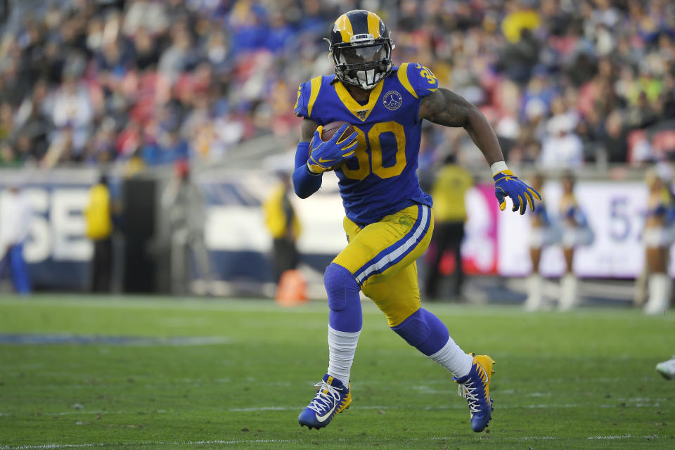 FILE - In this Dec. 29, 2019, file photo, Los Angeles Rams running back Todd Gurley runs a play during the first half of an NFL football game against the Arizona Cardinals, in Los Angeles. The Atlanta Falcons have agreed to a one-year deal with three-time Pro Bowl running back Todd Gurley, one day after he was cut by the Los Angeles Rams. A person familiar with the deal told The Associated Press about the agreement on Friday, March 20, 2020, on condition of anonymity because the deal will not be official until Gurley passes a physical. (AP Photo/Mark J. Terrill, File)