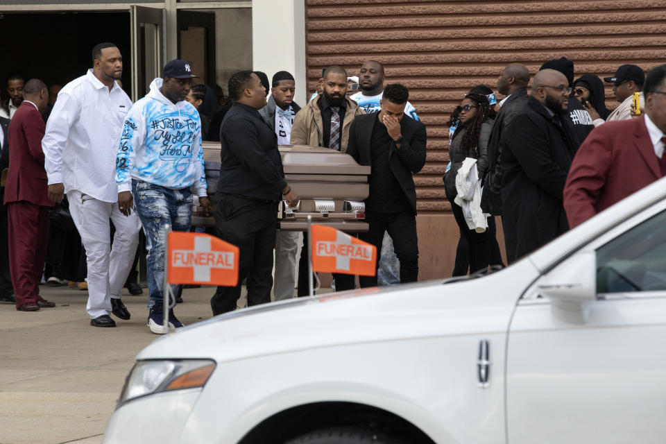 The casket of 26-year-old Jemel Roberson is carried out of the church after his funeral at House of Hope Church Saturday, Nov. 24, 2018, in Chicago. Friends and family attended funeral services for the security guard who was fatally shot by a suburban Chicago police officer outside the bar where he worked. Roberson was killed on Nov. 11 while holding at gunpoint a man who'd been involved in an earlier shooting at the bar in Robbins, just south of Chicago. (Erin Hooley/Chicago Tribune via AP)