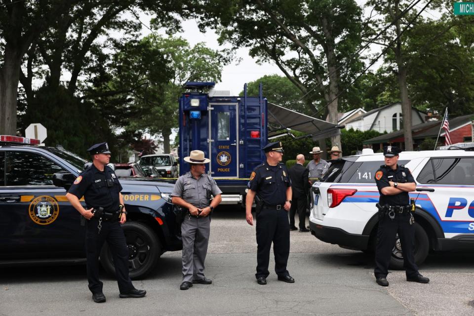 Law enforcement officials at the home of the suspect arrested in the unsolved Gilgo Beach killings (Getty Images)
