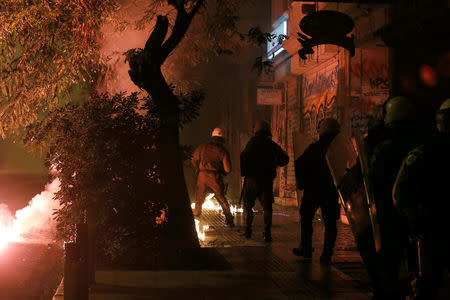 Flares are thrown at riot police during clashes following an anniversary rally marking the 2008 police shooting of 15-year-old student, Alexandros Grigoropoulos, in Athens, Greece, December 6, 2017. REUTERS/Alkis Konstantinidis