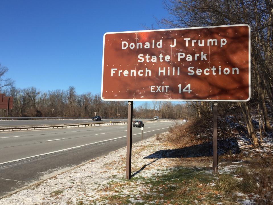 Motorists pass a sign for the French Hill Section of Donald J. Trump State Park, heading north on the Taconic State Parkway in Westchester County, New York. (Photo: Michael Walsh/Yahoo News)