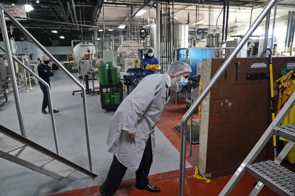 Rabbi Joseph Schwartz inspects some machinery as he supervises the koshering for Hanan Products' kosher-for-passover production run, Thursday, Jan. 7, 2021, in Hicksville, N.Y. (AP Photo/Seth Wenig)