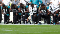 NFL Football - Jacksonville Jaguars vs Baltimore Ravens - NFL International Series - Wembley Stadium, London, Britain - September 24, 2017 Jacksonville Jaguars players kneel during the U.S. national anthem before the match Action Images via Reuters/Paul Childs