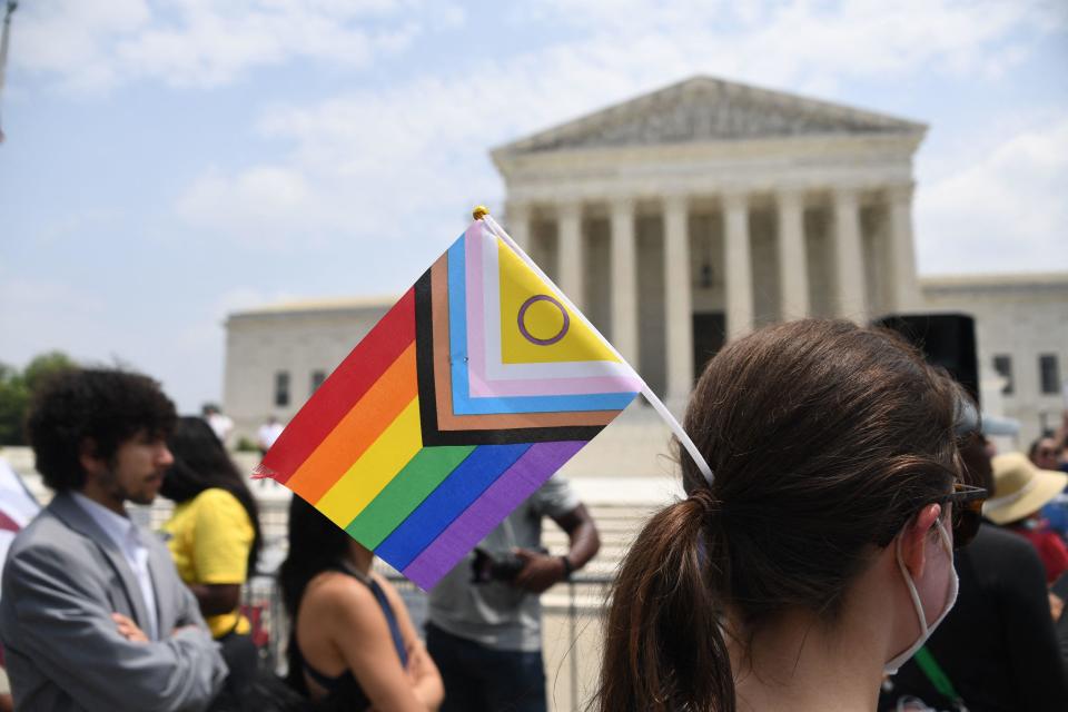 Activists for LGBTQ+ rights demonstrate outside the U.S. Supreme Court on June 30, 2023. / Credit: OLIVIER DOULIERY/AFP via Getty Images