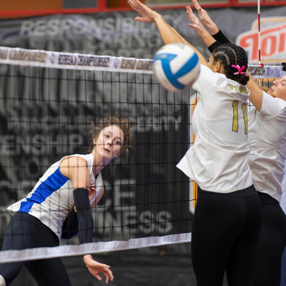 Washburn Rural's Brooklyn DeLeye (17) spikes the ball against Blue Valley on Saturday. DeLeye will play volleyball for the University of Kentucky next year.