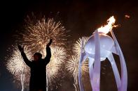 <p>Fireworks erupt as the cauldron is lit with the Olympic flame during the opening ceremony of the Pyeongchang 2018 Winter Olympic Games at the Pyeongchang Stadium on February 9, 2018. / AFP PHOTO / POOL / David J.PHILIP </p>