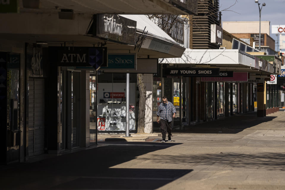 A lone person walks along the usually busy Maude Street Mall in Shepparton on Tuesday. Source: AAP