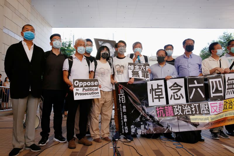 Pro-democracy activists, including Lee Cheuk-yan and media tycoon Jimmy Lai, arrive at the West Kowloon Courts, in Hong Kong