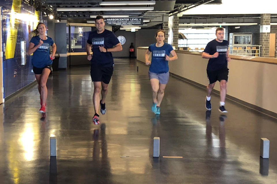 CORRECTS SPELLING TO WELSH, NOT WALSH - In this August 2019 photo, Kirsten Welsh, left and Katie Guay, second from right, participate in the NHL's annual officials exposure combine in Buffalo, N.Y. Guay and Welsh were among four females selected by the NHL on Friday, Sept. 6, 2019, to be the first women to work as on-ice officials at several prospect tournaments taking place across the country this weekend. The other two women selected were Kelly Cooke and Kendall Hanley. (AP Photo/John Wawrow)