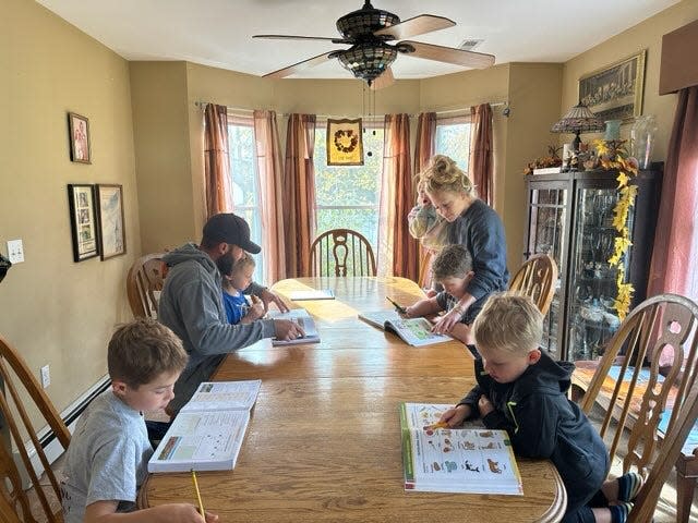 The Barker family of gathers around the kitchen table in Jackson to homeschool their children. They are part of a growing proportion of parents who are choosing homeschooling rather than public education.