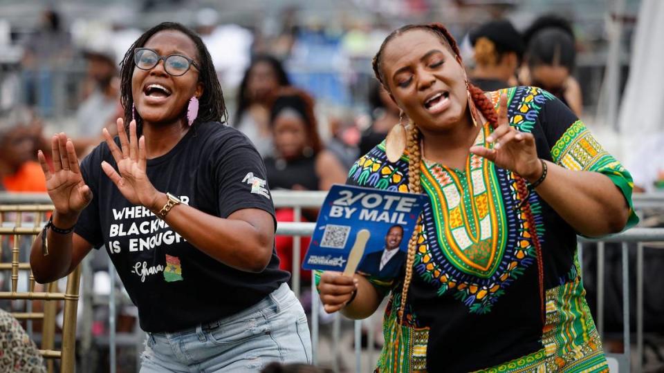 Sisters, Saisha Delevoe and Anna Delevoe, left to right, dance to the music during the 4th Annual Juneteenth Park-In and Party Celebration under this year’s theme, “America Keeps Its Promise of Freedom For All!” at Hard Rock Stadium in Miami Gardens, Florida on Saturday, June 15, 2024.