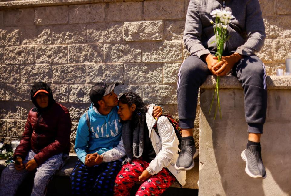 <div class="inline-image__caption"><p>Migrants embrace as they sit with others during a protest outside the National Institute of Migration building after a fire broke out late on Monday at a migrant detention center, in Ciudad Juarez, Mexico, March 28, 2023.</p></div> <div class="inline-image__credit">JOSE LUIS GONZALEZ/Reuters</div>