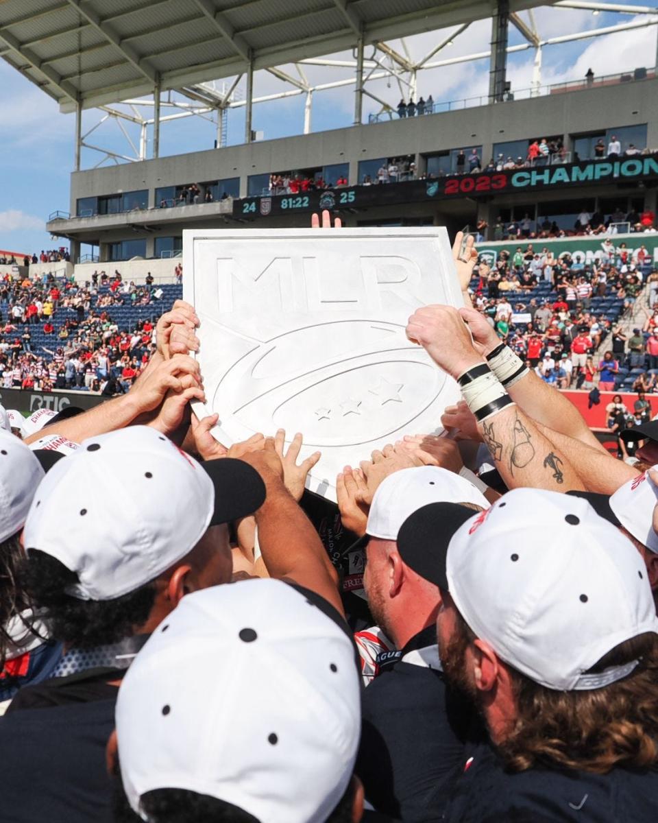 Members of the New England Free Jacks hold up the championship shield after their victory on Saturday, July 8.