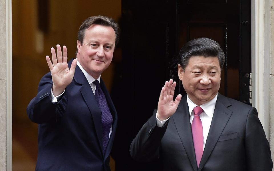 British Prime Minister David Cameron (L) waves as he greets Chinese - LEON NEAL