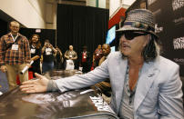 Actor Mickey Rourke, who gives voice to Richard "Demo Dick" Marcinko in the Bethesda video game Rogue Warrior, attends an autograph session during the Electronic Entertainment Expo or E3 in Los Angeles June 2, 2009. The convention runs June 2-4. REUTERS/Mario Anzuoni (UNITED STATES ENTERTAINMENT BUSINESS)