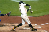 Pittsburgh Pirates' Bryan Reynolds hits a solo home run off Chicago Cubs relief pitcher Manuel Rodriguez during the seventh inning of a baseball game in Pittsburgh, Friday, Sept. 23, 2022. (AP Photo/Gene J. Puskar)