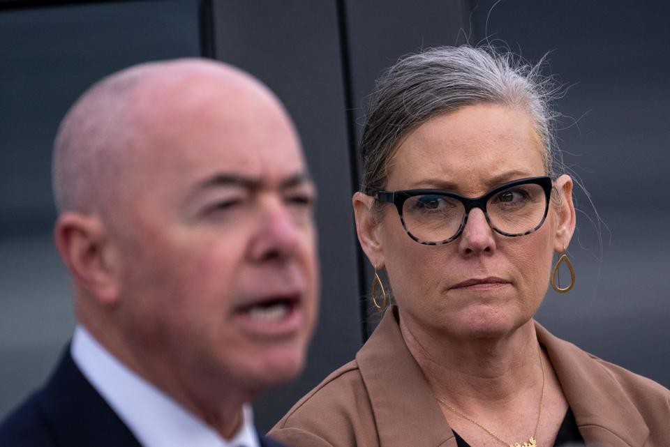 Secretary of the Department of Homeland Security Alejandro N. Mayorkas, left, and Arizona Governor Katie Hobbs, right, attend a press conference at the U.S. Customs and Border Protection Mariposa Port of Entry in Nogales on March 21, 2023.
