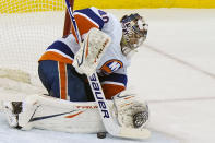 New York Islanders goaltender Semyon Varlamov (40), makes a save during the third period of an NHL hockey game, Tuesday, March 2, 2021, in Newark, N.J. (AP Photo/Kathy Willens)