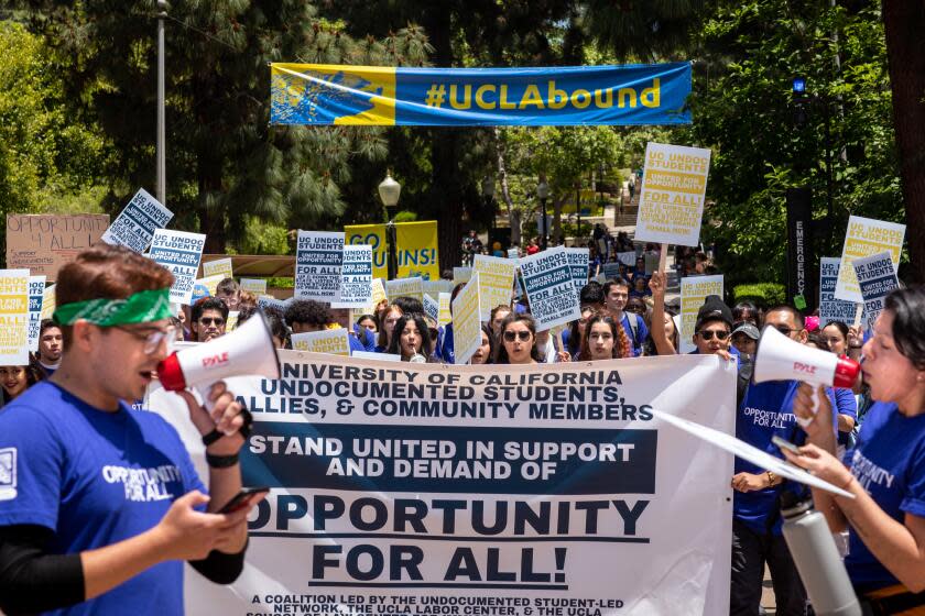 Los Angeles, CA - May 17: Students and supporters gathered to support undocumented students in the University of California system, rallying and marching to protest outside a meeting of the UC Board of Regents meeting, on the UCLA Campus in Los Angeles, CA, Wednesday, May 17, 2023. The rally wants to demand the UC Board of Regents break legal ground and authorize the hiring of students who were brought to this country illegally as children and lack valid work permits. (Jay L. Clendenin / Los Angeles Times)