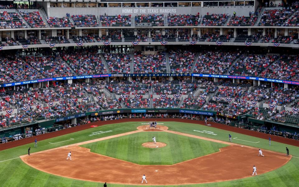 Texas Rangers play the Toronto Blue Jays. - Jeffrey McWhorter/AP