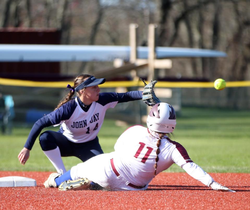 Arlington's Catherine Kelly slides into second base under John Jay's Hannah Greer during Thursday's game on April 28, 2022.