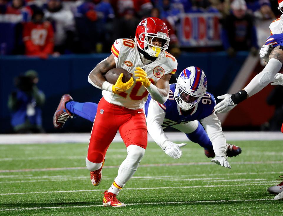 Kansas City Chiefs running back Isiah Pacheco (10) beats a tackle.