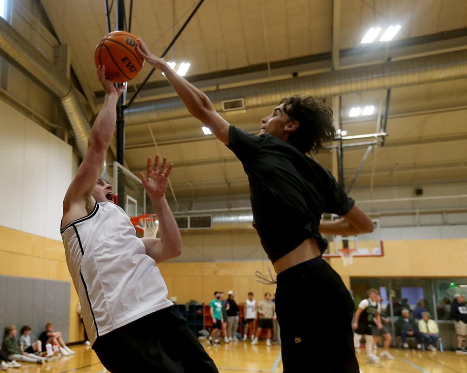 Mike Scully, 17, of the Meatballs blocks the shot of fire fighter/ paramedic Vincent Delvecchio of the Hose Bros during the second Points and Pints for Patrick at the Marshfield Boys and Girls Club on Saturday, Oct. 21, 2023. Twenty nine teams participated in the tournament. Proceeds of the tournament support the bone marrow failure program at Boston Children’s Hospital.