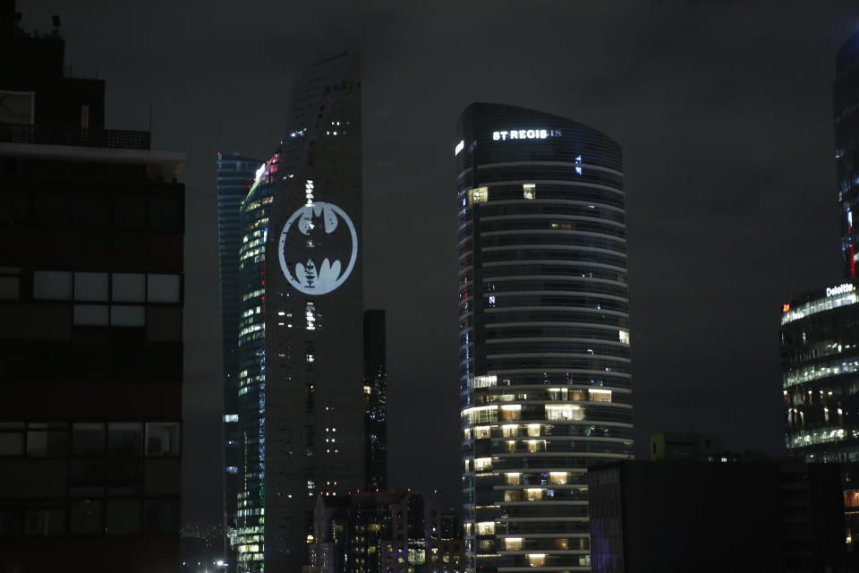 A Bat signal is lit in the Torre Reforma during the commemorating of Batman's 80th anniversary in Mexico City, Saturday, Sept. 21, 2019. (AP Photo/Ginnette Riquelme)