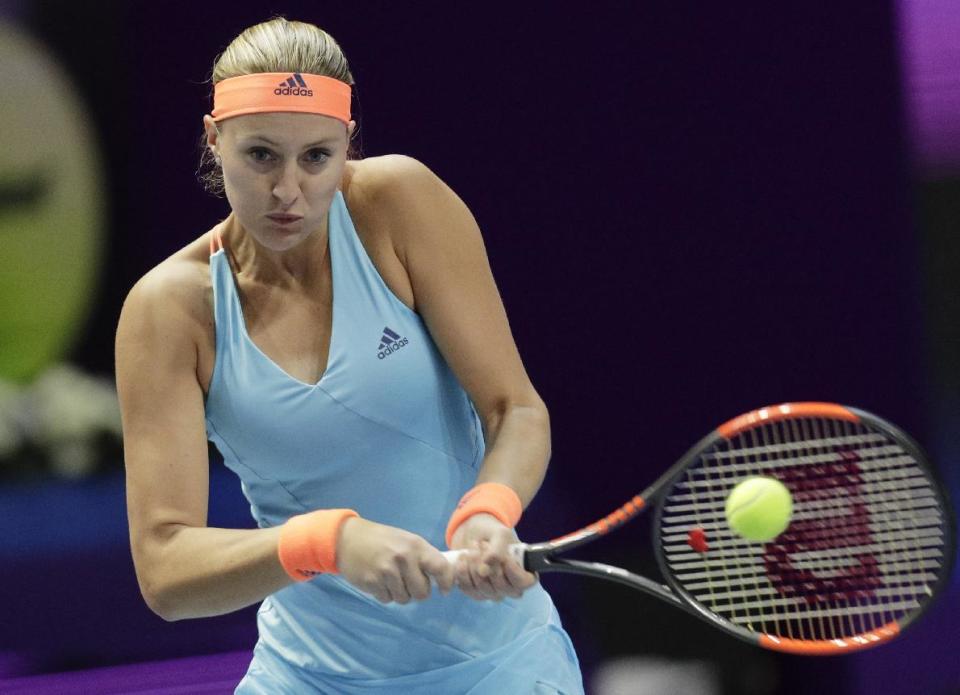 Kristina Mladenovic of France returns the ball to Venus Williams of U.S. during the St. Petersburg Ladies Trophy-2017 tennis tournament match in St. Petersburg, Russia, Thursday, Feb. 2, 2017. (AP Photo/Dmitri Lovetsky)