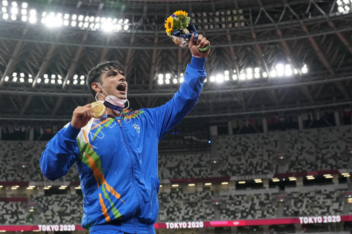 Gold medalist Neeraj Chopra, of India, poses during the medal ceremony for the men's javelin throw at the 2020 Summer Olympics, Saturday, Aug. 7, 2021, in Tokyo. (AP Photo/Martin Meissner)